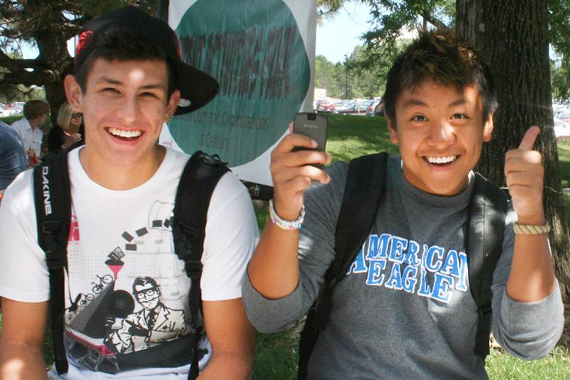 Two students giving the thumbs up!