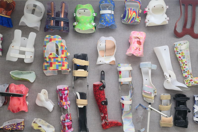 A wall of Orthotic devices built by students at Century College.