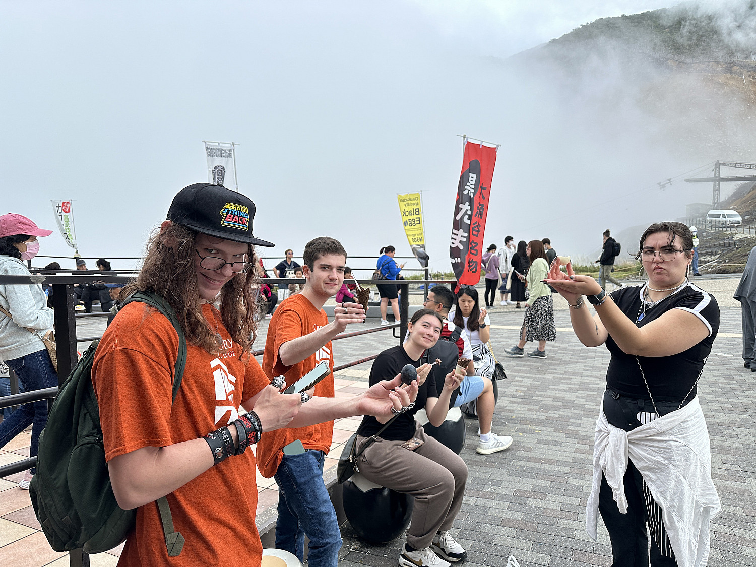 SPR24 study abroad students enjoying owajudani 'Volcano Eggs' at the base of Mount Fuji.