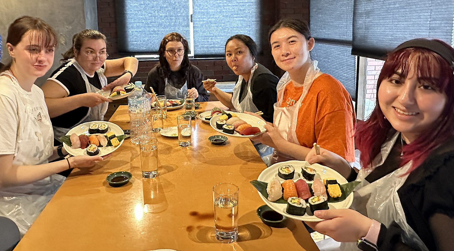 SPR24 Study abroad students taking a sushi making class.