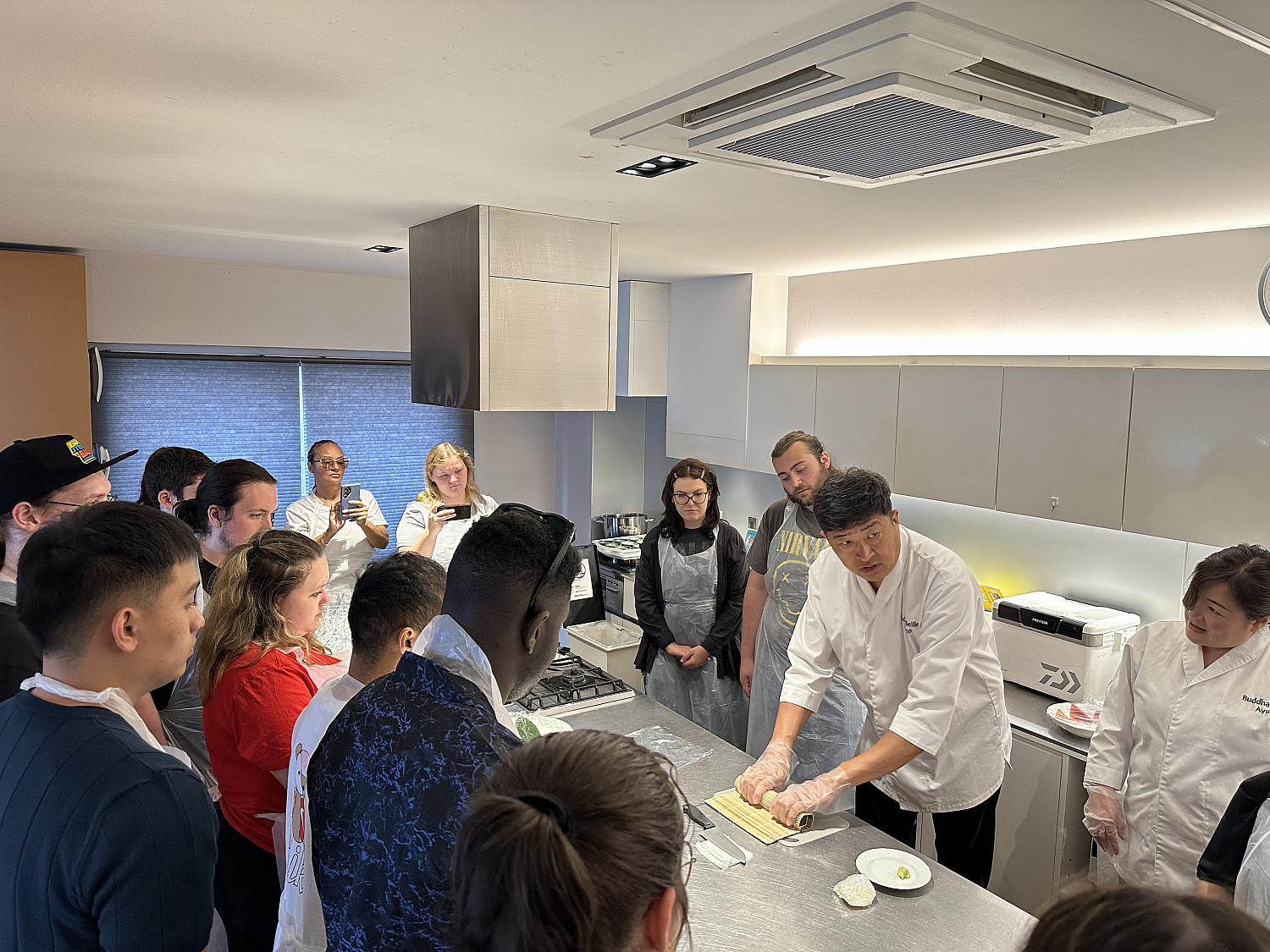 SPR24 Study abroad students taking a sushi making class.